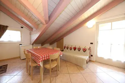 a dining room with a table and chairs at Villa Marta in Mazzin