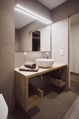 a bathroom with a sink and a mirror at Apartments Knappenhof Pfitsch - with Swimming Pool in Val di Vizze