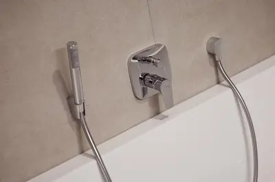 a bathroom sink with a faucet on a wall at Apartments Knappenhof Pfitsch - with Swimming Pool in Val di Vizze