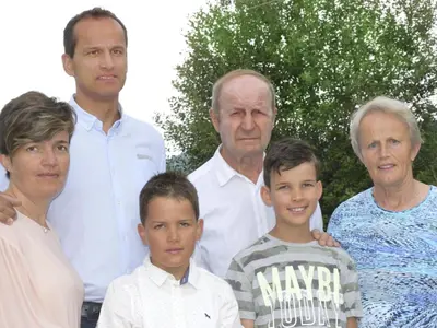 a group of people posing for a picture at Apartment Morgensonne by Interhome in Maranza