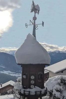 a weather vane on top of a house with snow on it at Apartment App- Haselstaude by Interhome in Maranza