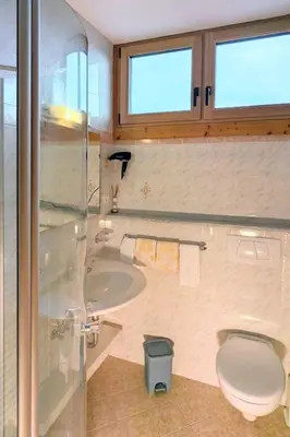 a bathroom with a toilet and a tub and a sink at Apartment App- Haselstaude by Interhome in Maranza
