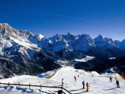 a group of people standing on a snow covered mountain at Holiday Home Romantisches Chalet in den Wiesen der Dolomiten by Interhome in Mezzano