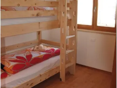 a couple of bunk beds in a room at Apartment Rosenheim Appartement 2 by Interhome in Maranza
