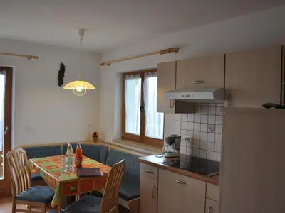 a kitchen with a table and a dining room at Apartment Rosenheim Appartement 4 by Interhome in Maranza