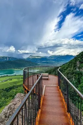 a walkway with a bench on top of a mountain at Apartment Bergblick by Interhome in Castelvecchio