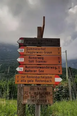 a wooden sign on a hill with signs on it at Apartment Bergblick by Interhome in Castelvecchio