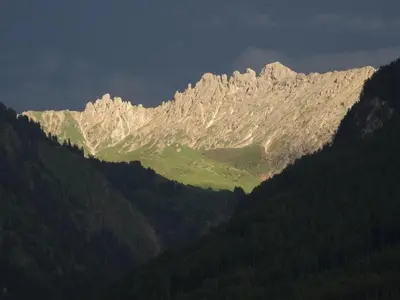 a mountain range with a green field in the middle at Apartment in Seis by Interhome in Siusi