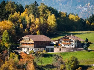a large house on a hill in a field at Apartment in Seis by Interhome in Siusi
