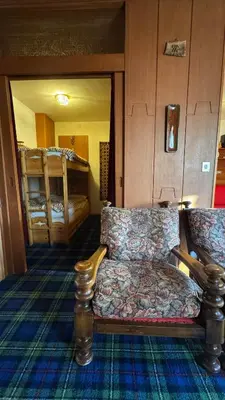 a living room with a couch and two bunk beds at Apartment in the center of Cortina with private garage in Cortina dʼAmpezzo