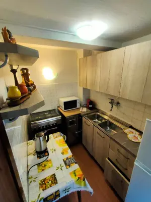 a kitchen with a counter with food on it at appartamento Casa Lucia in Cencenighe