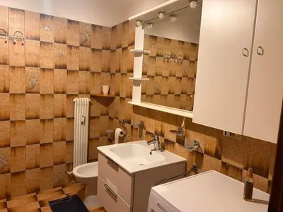 a bathroom with a sink and a toilet at Casa Iris in Laives