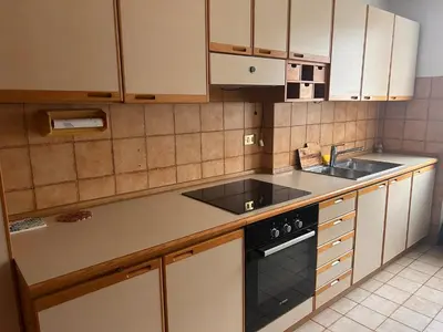a kitchen with a sink and a stove at Casa Iris in Laives