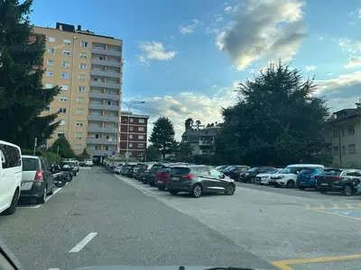 a parking lot with a lot of parked cars at Casa Iris in Laives