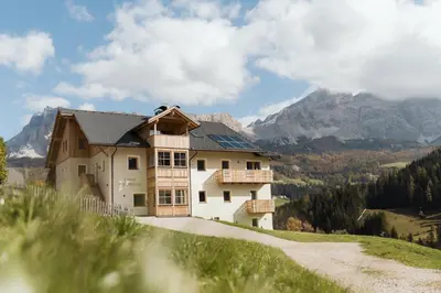 a building on top of a snow covered mountain at Ciasa Bel Marin in La Villa