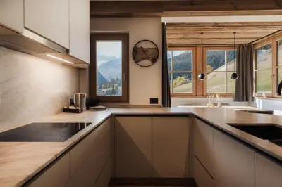a kitchen with a view of a mountain at Ciasa Bel Marin in La Villa