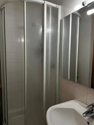 a bathroom with a shower and a sink at Appartamento panoramico vicino al Kronplatz in Riscone