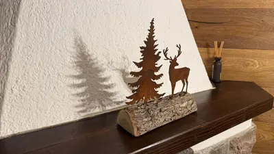 a picture of a deer and a christmas tree on a wall at Flowery House Canazei - Val di Fassa in Canazei