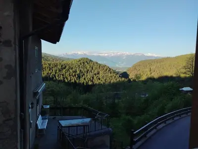 a balcony of a building with a view of the mountains at Casa Rita Brenta - Ruffrè-Mendola in Ronzone