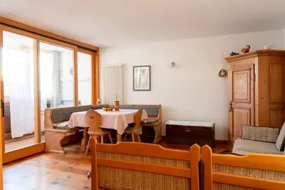 a dining room with a table and a window at Casa Rita Brenta - Ruffrè-Mendola in Ronzone