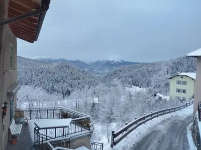 a view of a snow covered mountain from a house at Casa Rita Brenta - Ruffrè-Mendola in Ronzone