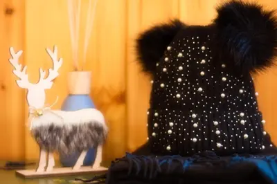 a stuffed animal with a hat and a moose on a shelf at Chalet Salejada - WiFi comfort and elegance in Moena