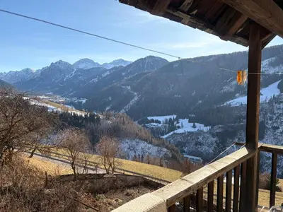 a view of the mountains from the balcony of a cabin at Agriturismo Ciastel de Brach in Longega