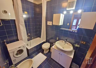 a small kitchen with a sink and a microwave at HT - Appartamento centrale nel cuore delle Dolomiti in San Vito di Cadore