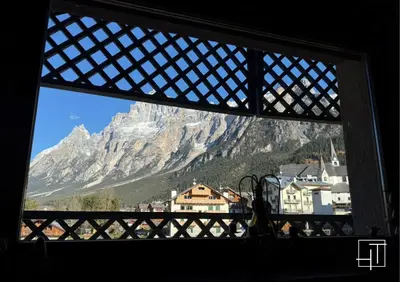a view of a mountain from a window at HT - Chalet panoramico con vista sulle Dolomiti in San Vito di Cadore