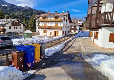 a village in the snow with trash cans at HT - Ciasa Ca' Novella nel cuore delle Dolomiti in San Vito di Cadore