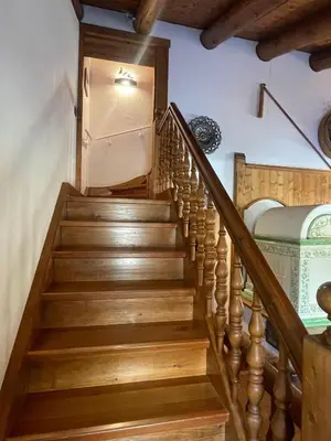 a staircase in a house with wooden floors at Chalet Alba in Cortina dʼAmpezzo