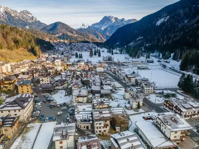 an aerial view of a town in the mountains at Ciasa al Caselo in Falcade