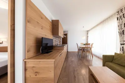 a living room with a tv and a couch at Torgglerhof in Schenna