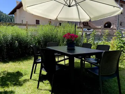a bedroom with two beds and a window at Mountain Breeze in Castello di Fiemme