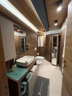 a room with a wooden ceiling and a bed at Casa PAOLINA OLIMPIC 2026 in San Vito di Cadore