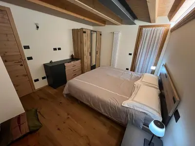 a bathroom with two sinks and a toilet and a shower at Casa PAOLINA OLIMPIC 2026 in San Vito di Cadore