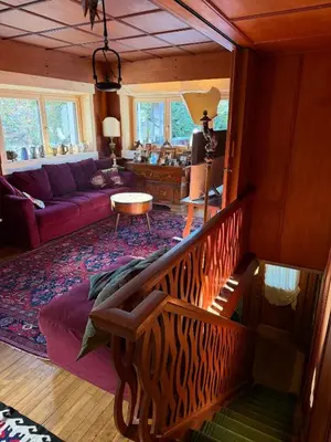 a living room with a couch and a table at Casa panoramica con terrazza vista Tofane in Cortina dʼAmpezzo