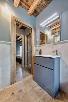 a kitchen with a sink in a room at Olympic Comfy Trimestate Ampezzo s Flat in San Vito di Cadore