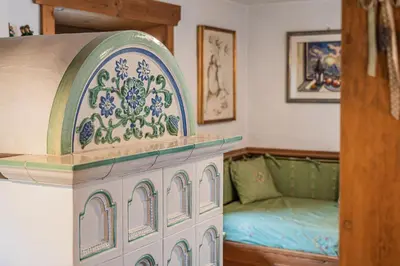 a spiral staircase in a tiny house at Da La Auri in Canale dʼAgordo