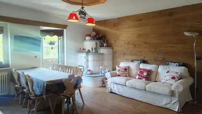 a living room with a white couch and a table at 70 sqm apartment in Moena in Moena