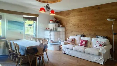 a living room with a white couch and a table at 70 sqm apartment in Moena in Moena