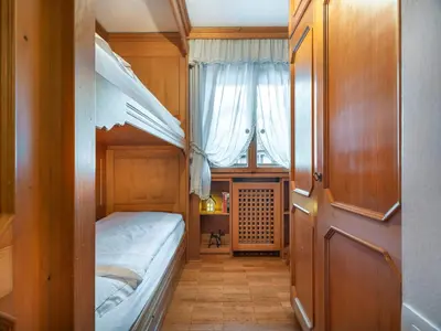 a bathroom with a sink and a mirror at Cianderies Cozy Apartment R&R in Cortina dʼAmpezzo
