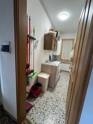 a small bathroom with a toilet and a sink at Il sole di Varena in Varena