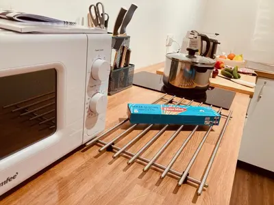 a microwave oven sitting on top of a kitchen counter at primiero-suite 45mq in Transacqua