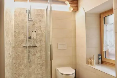 a bathroom with a sink and a window at Ciesa Le Crepedele Miniappartamento Zenabona in Sottoguda