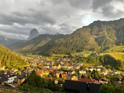 a town in a valley with mountains in the background at Resciesa Hof in Ortisei