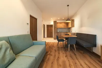 a living room with a couch and a table at Residence Louise in Vipiteno