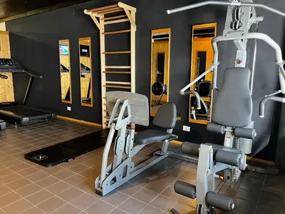 a gym with two tread machines in a room at Grifone Dolomiti Residences in Arabba