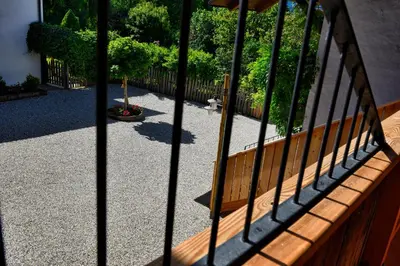 a wooden bench sitting on top of a patio at Apartments Mitterhof 1544 in Brunico
