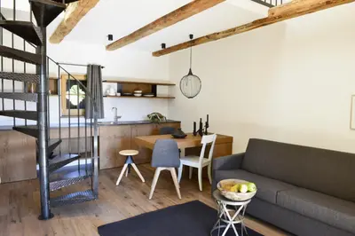 a living room with a couch and a table at Apartments Mitterhof 1544 in Brunico